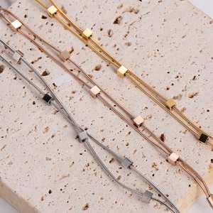 Fashionable double-layered snake chain bracelet with cubes in gold, silver, and rose gold