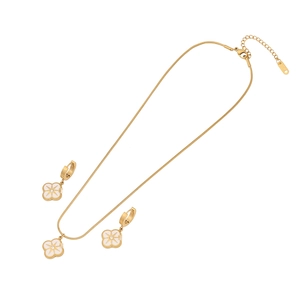 Golden stainless steel jewelry set featuring white clover pendants with starburst details