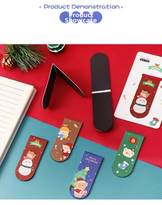 Close-up of colorful Christmas magnetic bookmarks with snowman and bear designs