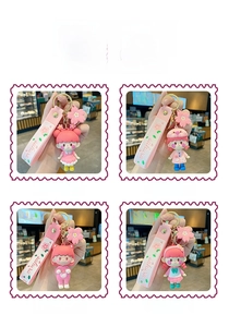 Detail of four cute sakura girl keychains with PVC dolls and soft silicone wrist straps