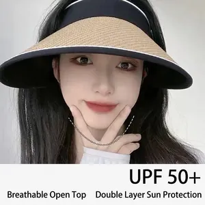 UPF50+ women's sun hat with large brim and straw texture in black and white contrast