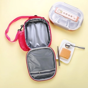Detail of insulated pink unicorn lunch bag with stainless steel bento box and silver lining