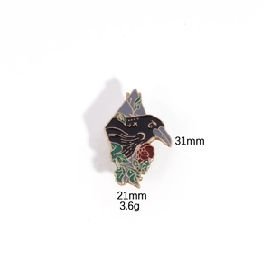 Detail of crow with rose enamel pin showing dimensions 31mm x 21mm and 3.6g weight