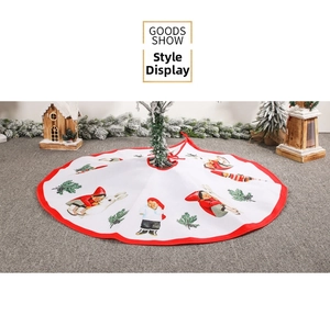 Detailed view of white Christmas tree skirt with festive holiday character prints