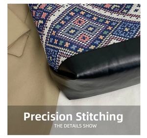 Detail showing the precision stitching between bohemian woven fabric and black leather