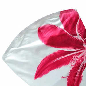Detail of pink floral print on smooth white fabric of the bodycon mini dress