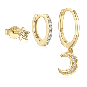 Close-up of gold S925 silver earring set featuring star, moon and hoop designs with crystals