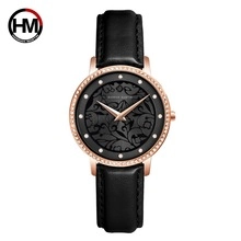 Detail of Hannah Martin women's watch featuring a crystal bezel and black floral dial