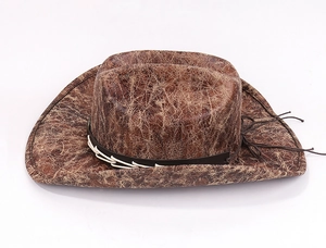 Detail of vintage brown faux suede cowboy hat with cracked texture and braided band