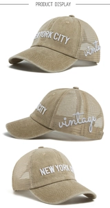 Close-up of vintage washed baseball cap with New York City embroidery and mesh back