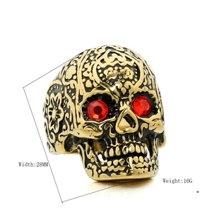 Gothic gold skull ring for men with red gemstone eyes and vintage floral carvings