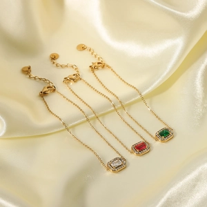 Elegant 18K gold plated bracelet with emerald and ruby cubic zirconia geometric pendants