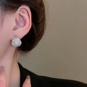 Elegant teardrop zircon earrings in S925 sterling silver worn by model in macro view