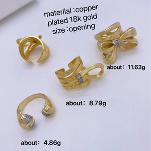 Brushed 18K gold plated copper bow rings in four unique minimalist open designs