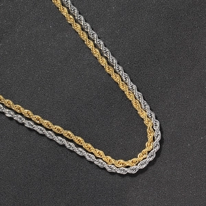 Detailed close-up of 5mm gold and silver stainless steel rope chains with a polished finish