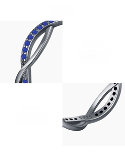 Detailed macro shot of S925 sterling silver stamp and blue lapis lazuli on the twisted ring