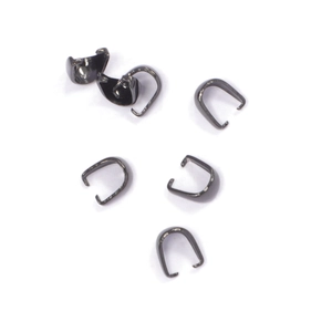 Close-up of five dark grey stainless steel pinch bails for DIY jewelry making