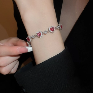 Luxurious pink heart zircon bracelet on wrist with elegant silver finish