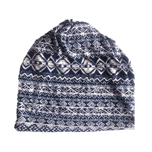 Detailed pattern view of ethnic blue and white geometric print on versatile slouchy beanie