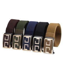 Detail of five woven nylon belts with geometric H-buckles in assorted colors