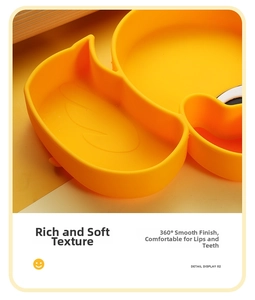 Detail of soft yellow duck silicone baby plate with rounded edges and thick walls
