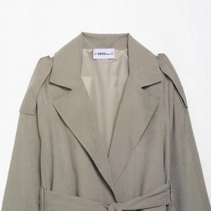 Women's minimalist khaki velvet coat featuring a lapel collar and waist tie details