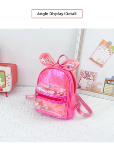 Detail view of pink sequin children backpack with cute 3D bunny ears and floral sequins