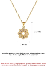 Close-up of gold titanium steel necklace with flower pendant and white cubic zirconia
