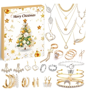 Close-up of Christmas advent calendar jewelry box with gold and silver necklaces and earrings