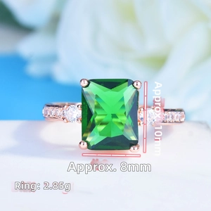 Detailed view of emerald-cut green gemstone ring with 10x8mm size and 2.85g weight