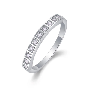 Macro side view of silver band ring featuring brilliant row-set pavé moissanite stones