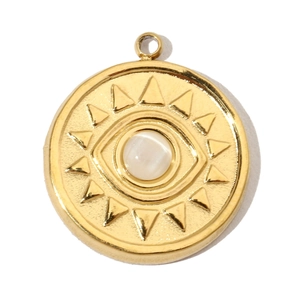 Detail showing a gold-plated sunburst eye pendant with a white opal gemstone center