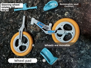 Disassembled blue balance car parts including T-bar handle, seat, wheels and frame