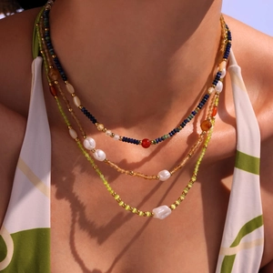 Handmade beaded necklace with natural lapis lazuli, red agate, and baroque pearls
