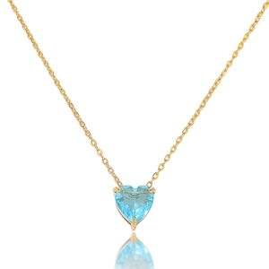 Detailed view of heart-shaped blue gemstone pendant with elegant gold chain necklace