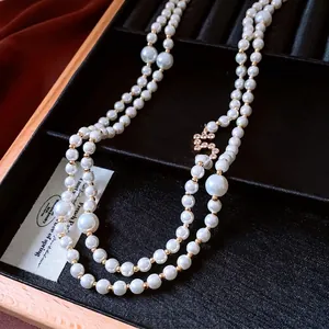 French vintage double-layered pearl necklace with zircon pendant on black velvet box