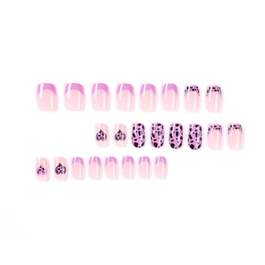 Short square press-on nails set with purple heart designs and cow print patterns