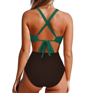 Detail of dark green cross-strap swimsuit back with adjustable bow tie closure