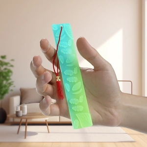 Leaf textured resin bookmark with green gradient and vibrant red tassel accessory