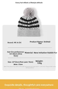 Detail view of striped winter knit hat with pom-pom made of soft faux rabbit hair