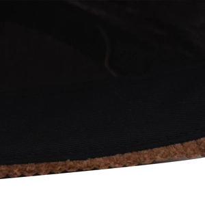 Detailed close-up of retro black corduroy fabric with brown plush trim on cap edge