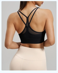 Detail of high-impact sports bra with mesh honeycomb stitching and cross-back straps