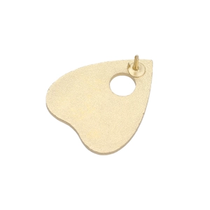 Golden planchette metal badge with pin back showing gothic skull and cat theme details