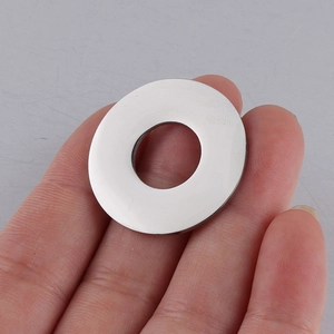 Close-up of hand holding a 25mm polished stainless steel hollow round pendant charm