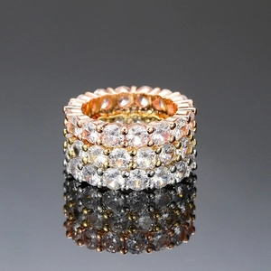 Three-piece stackable eternity rings set with 4mm round cubic zirconia in gold silver and rose gold