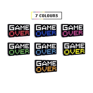 Detail view of 8-bit pixel Game Over LED lamp showing 7 distinct vibrant color modes