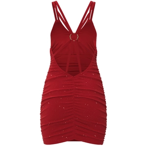 Detail of red backless dress with cross straps, metal ring and sparkly pleated fabric