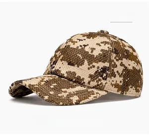 Detailed view of camouflage yellow woven straw baseball cap with structured six-panel design