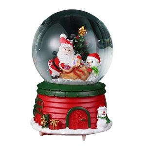 Christmas snow globe music box with Santa, snowman and red cottage house base