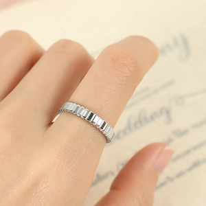 French vintage gear ring in silver stainless steel with vertical ribbed design on finger